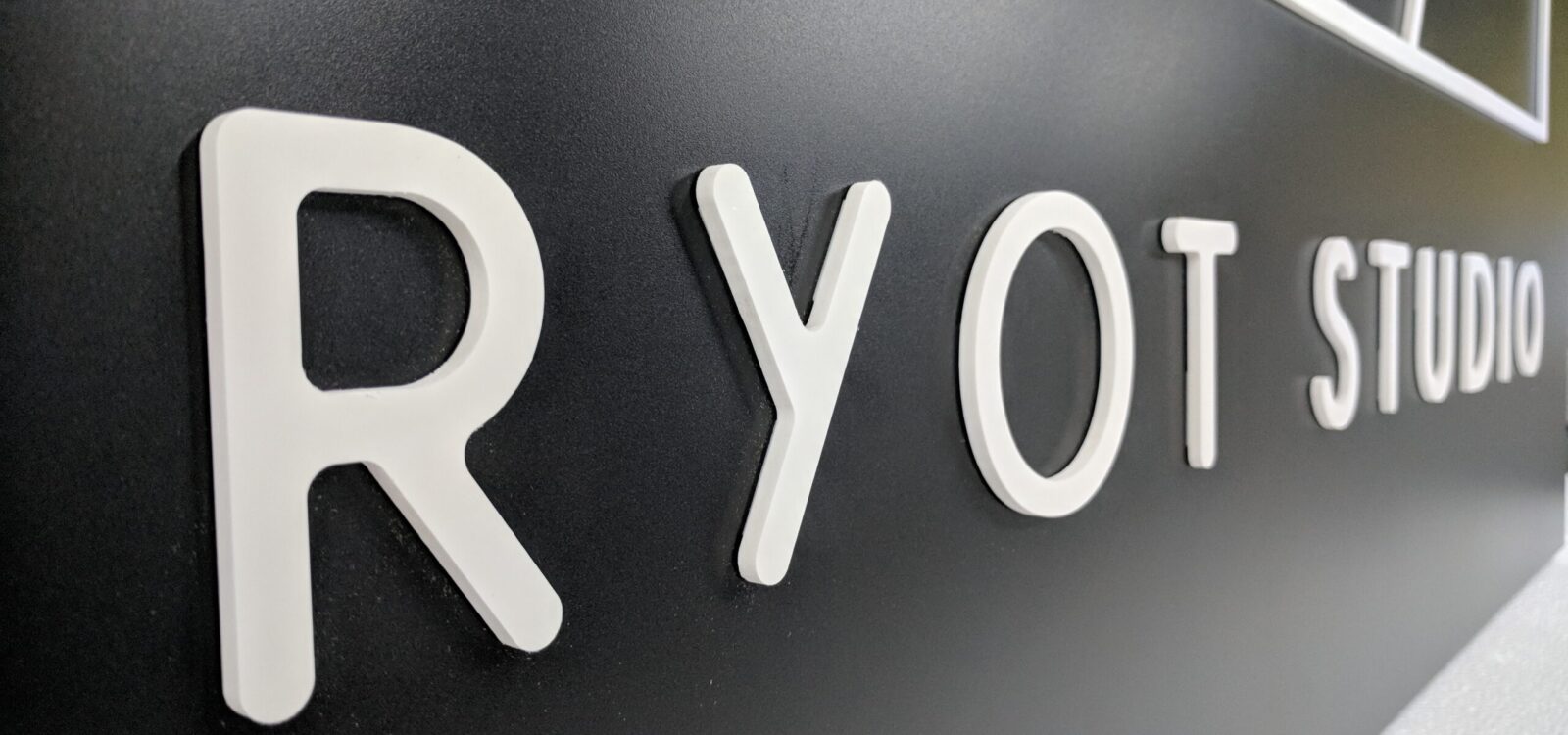 Close-Up Image Of The Foamex Faced Ryot Studio Logo